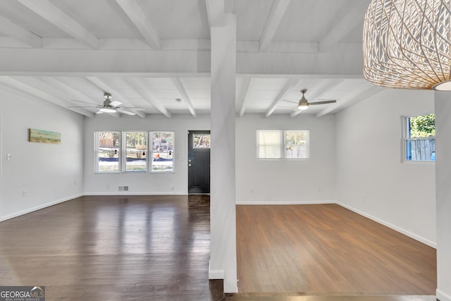 unfurnished living room with dark wood finished floors, baseboards, and ceiling fan