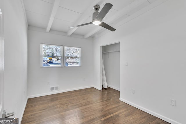 unfurnished bedroom featuring visible vents, ceiling fan, wood finished floors, beamed ceiling, and baseboards