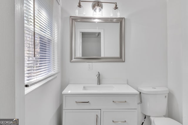 half bath with toilet and vanity