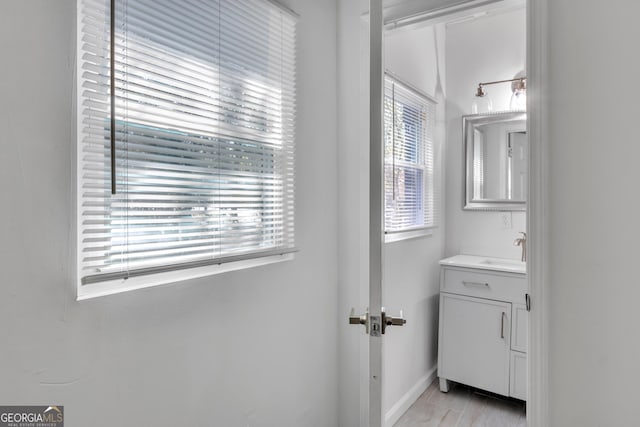 bathroom with vanity and baseboards