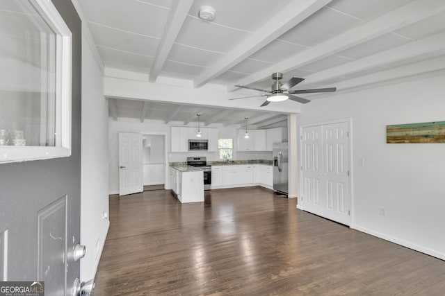 unfurnished living room with lofted ceiling with beams, dark wood-style flooring, a sink, a ceiling fan, and baseboards