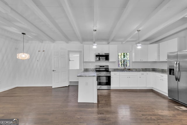 kitchen featuring dark wood-style flooring, beam ceiling, appliances with stainless steel finishes, white cabinetry, and a sink