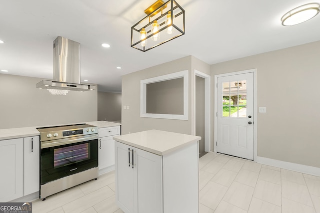 2682 Miriam Ln, Decatur, GA 30032 - kitchen featuring stainless steel range with electric stovetop, island exhaust hood, light countertops, white cabinetry, and recessed lighting