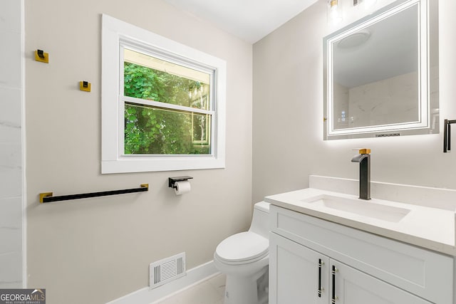 bathroom with marble finish floor, visible vents, toilet, vanity, and baseboards