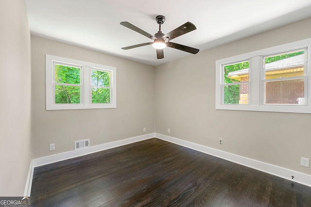2682 Miriam Ln, Decatur, GA 30032 - spare room featuring healthy amount of natural light, baseboards, dark wood-style floors, and ceiling fan