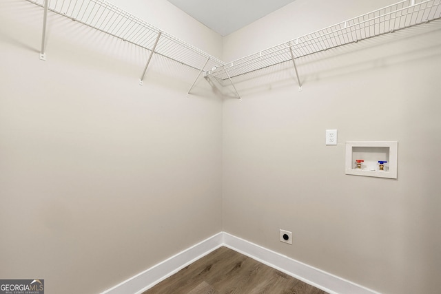 laundry room featuring washer hookup, dark wood-style flooring, electric dryer hookup, laundry area, and baseboards