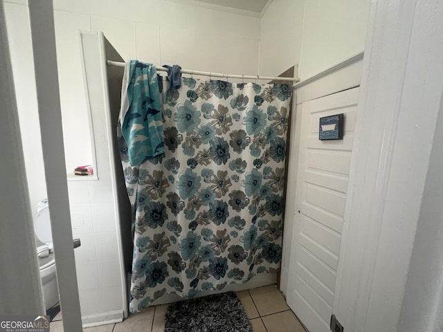 bathroom featuring curtained shower and tile patterned floors