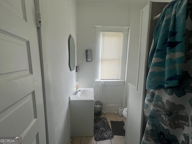 bathroom featuring vanity, curtained shower, tile patterned flooring, and toilet