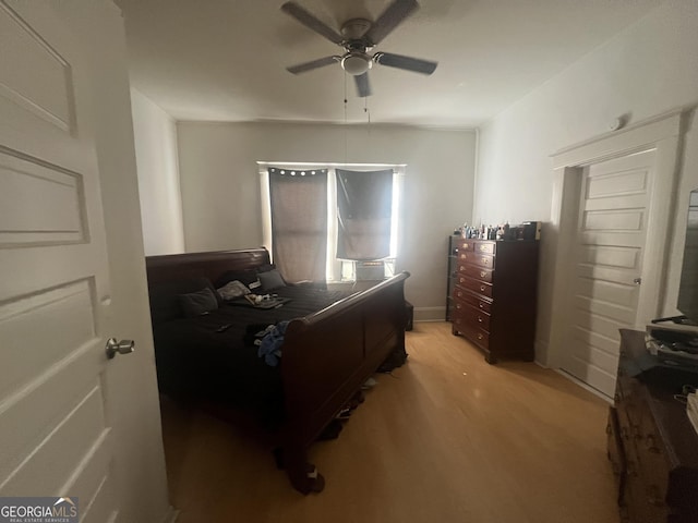 bedroom with ceiling fan and light wood-style flooring