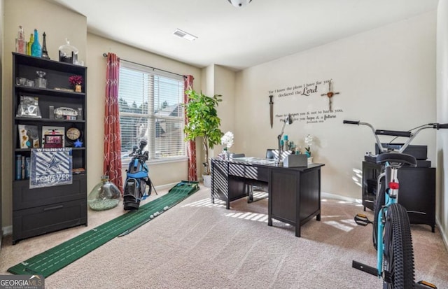 carpeted home office featuring visible vents and baseboards