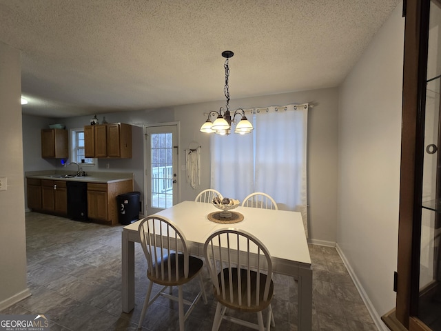 220 Joe Dr, Temple, GA 30179 - dining room featuring baseboards, a chandelier, and a textured ceiling