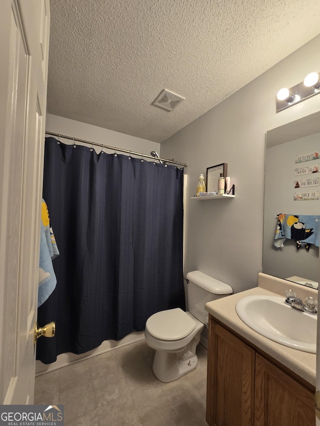 220 Joe Dr, Temple, GA 30179 - full bathroom featuring a textured ceiling, visible vents, toilet, tile patterned floors, and vanity