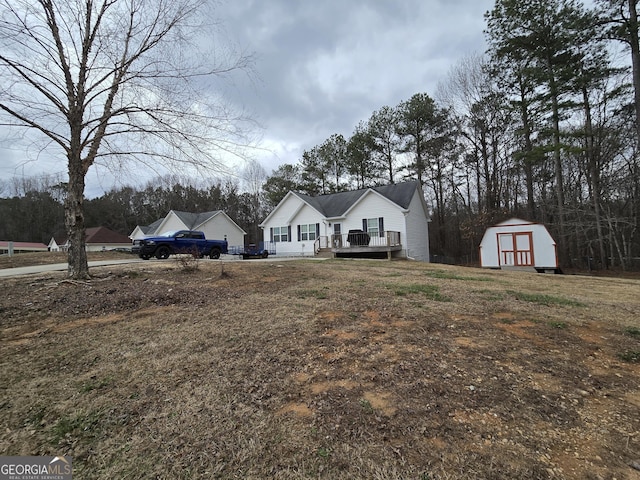 220 Joe Dr, Temple, GA 30179 - view of front of property featuring a wooden deck, an outbuilding, and a storage shed