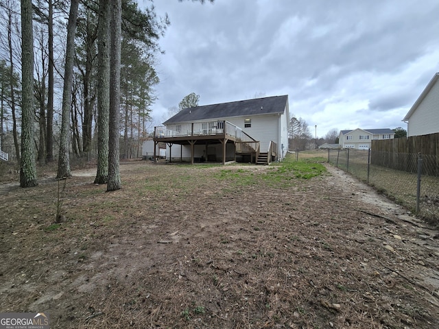 220 Joe Dr, Temple, GA 30179 - back of property featuring fence, a deck, and stairs