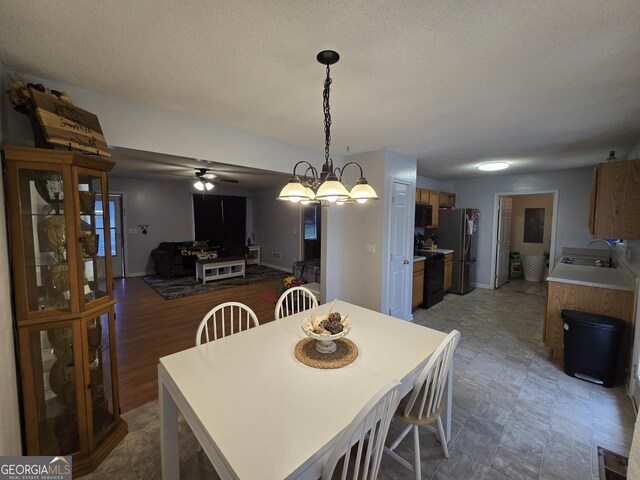 220 Joe Dr, Temple, GA 30179 - dining area with baseboards, visible vents, ceiling fan, and a textured ceiling
