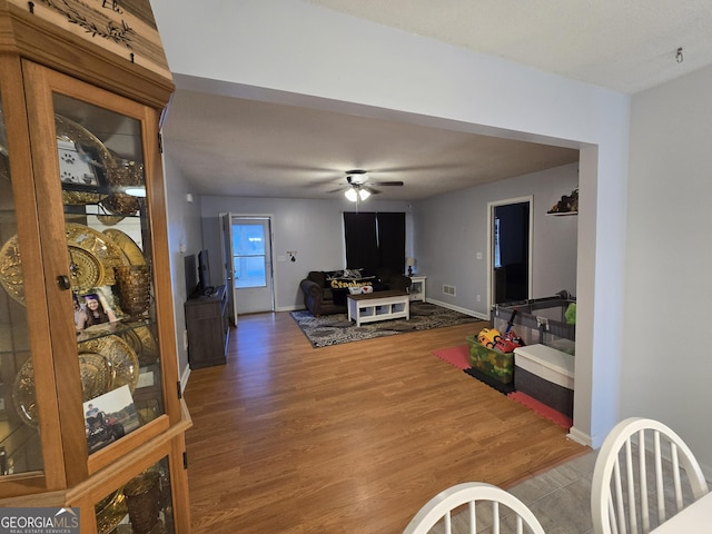 220 Joe Dr, Temple, GA 30179 - living room featuring baseboards, wood finished floors, and ceiling fan