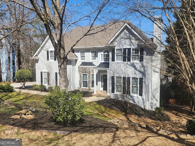 view of front of home featuring a chimney