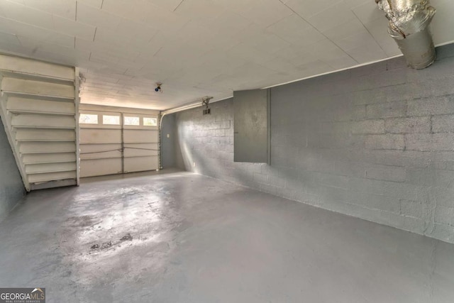 garage featuring concrete block wall