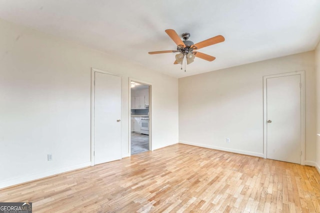 unfurnished bedroom with ceiling fan, baseboards, and wood finished floors