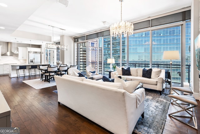 1065 Peachtree St NE Unit 3105, Atlanta, GA 30309 - living area featuring a chandelier, dark wood-type flooring, plenty of natural light, and floor to ceiling windows