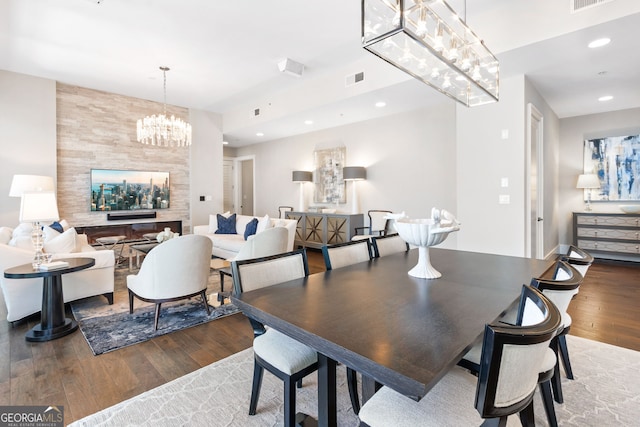 1065 Peachtree St NE Unit 3105, Atlanta, GA 30309 - dining space with wood finished floors, a chandelier, and recessed lighting