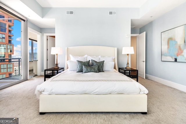 bedroom featuring access to outside, carpet, visible vents, and baseboards