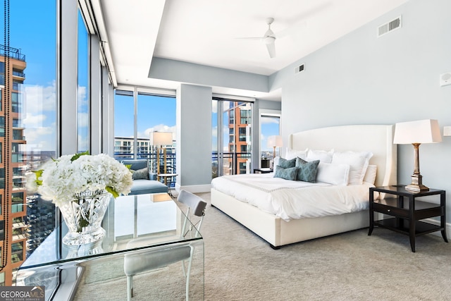 bedroom featuring a ceiling fan, baseboards, visible vents, and carpet floors