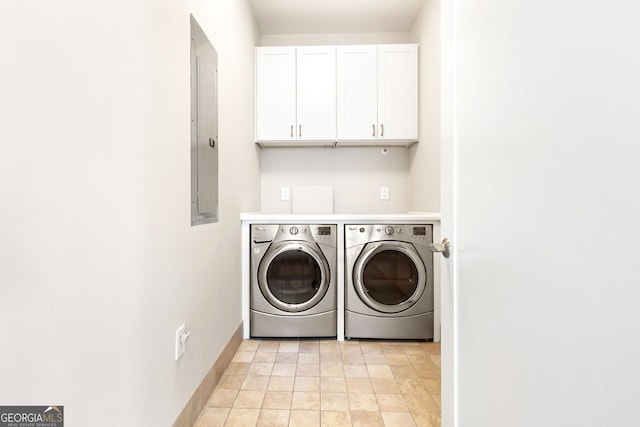1065 Peachtree St NE Unit 3105, Atlanta, GA 30309 - washroom featuring washer and dryer, cabinet space, baseboards, electric panel, and light tile patterned floors