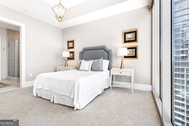 1065 Peachtree St NE Unit 3105, Atlanta, GA 30309 - bedroom with light carpet, a chandelier, and baseboards