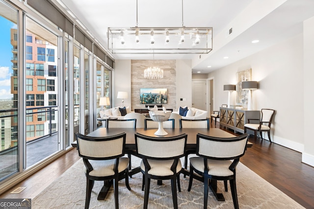 dining space featuring baseboards, visible vents, recessed lighting, dark wood-type flooring, and rail lighting