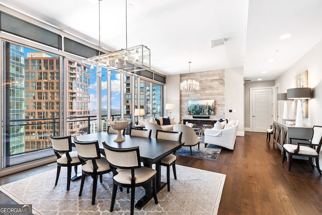 1065 Peachtree St NE Unit 3105, Atlanta, GA 30309 - dining space with a chandelier, hardwood / wood-style flooring, baseboards, and recessed lighting