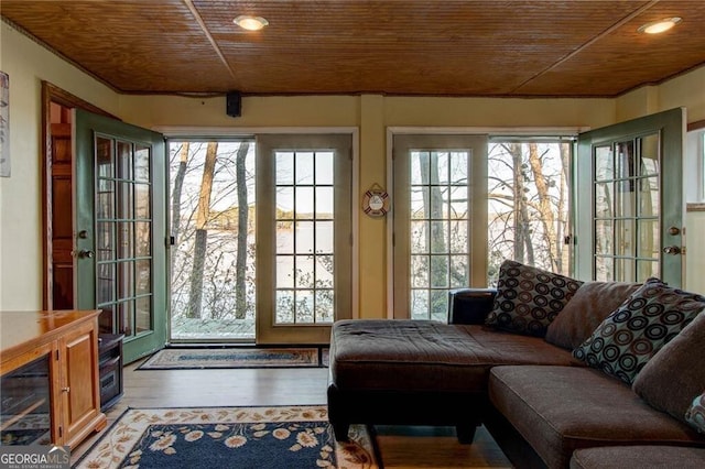 interior space with wooden ceiling, wood finished floors, and recessed lighting