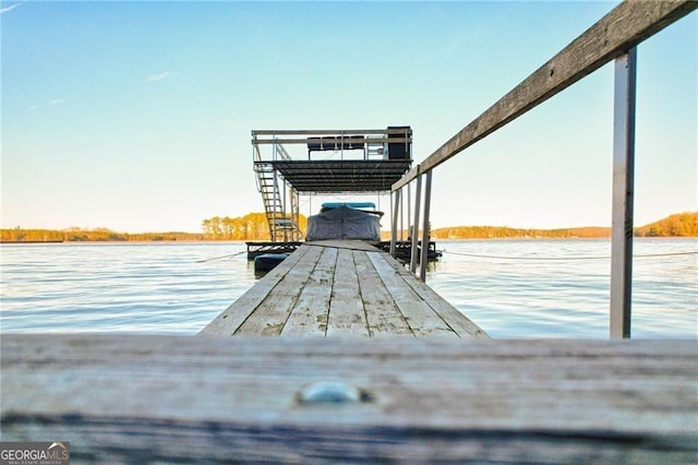 dock area with a water view