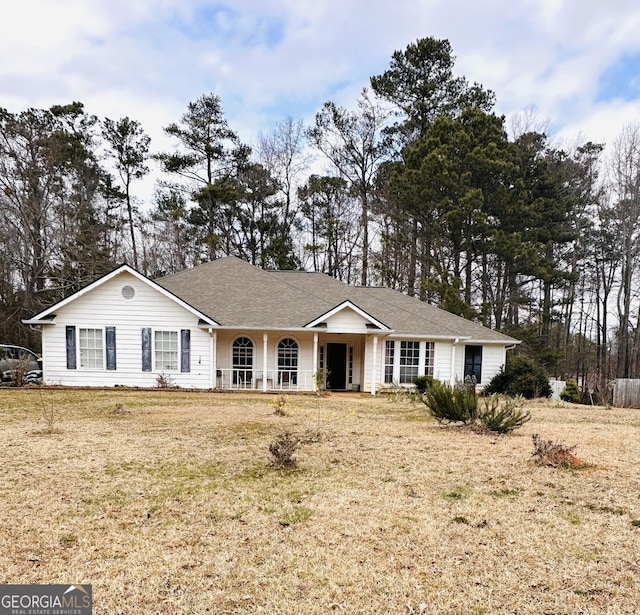 ranch-style house with a front yard