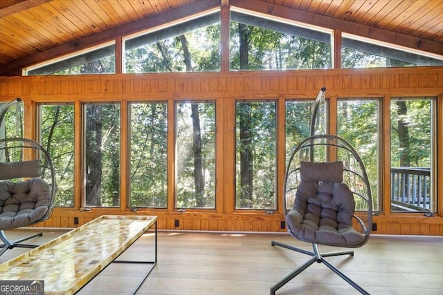 sunroom / solarium featuring lofted ceiling and wooden ceiling