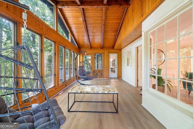 sunroom / solarium with lofted ceiling with beams and wood ceiling