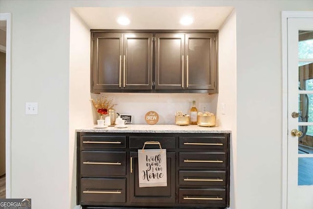 bar featuring a bar and recessed lighting