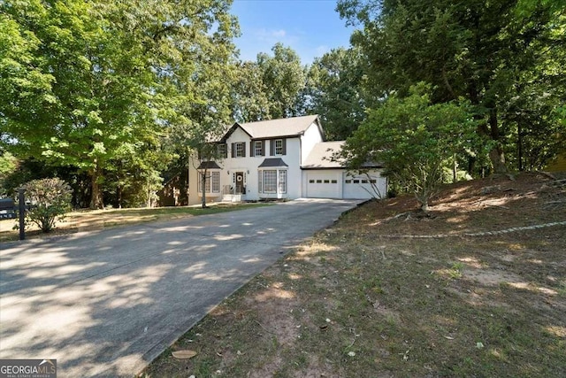 view of front of house with driveway and a garage