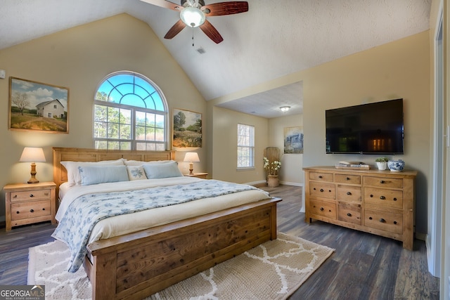 bedroom with visible vents, baseboards, a ceiling fan, dark wood-style flooring, and vaulted ceiling