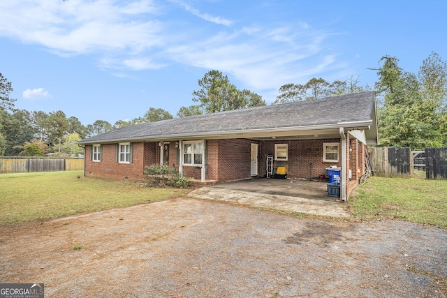 single story home with a front yard, crawl space, brick siding, and driveway