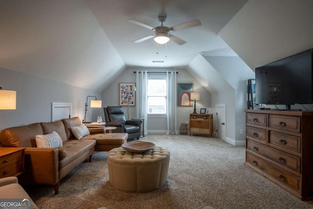 living area featuring light carpet, ceiling fan, baseboards, and lofted ceiling