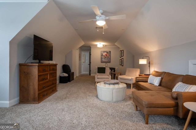 carpeted living area featuring lofted ceiling, ceiling fan, and baseboards