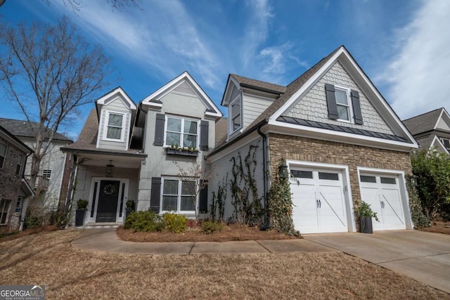 view of front of property featuring metal roof, concrete driveway, a standing seam roof, and stone siding