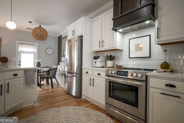 kitchen featuring premium range hood, appliances with stainless steel finishes, white cabinets, and crown molding