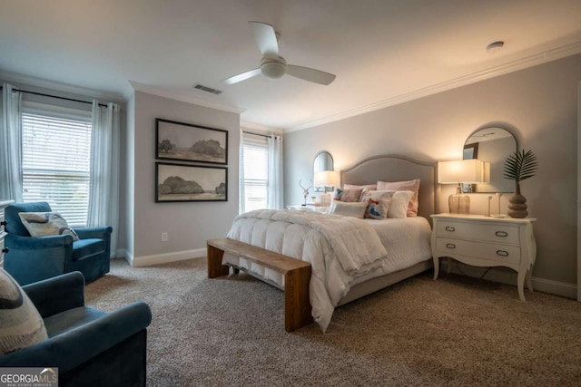 bedroom with visible vents, baseboards, a ceiling fan, ornamental molding, and carpet