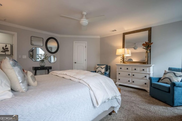 carpeted bedroom featuring ceiling fan, visible vents, and crown molding