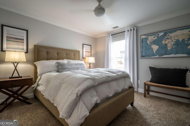 bedroom featuring ornamental molding, carpet flooring, visible vents, and baseboards