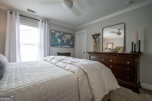 bedroom featuring carpet, crown molding, visible vents, ceiling fan, and baseboards