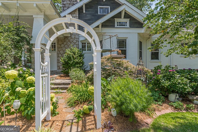 exterior space featuring stone siding and brick siding