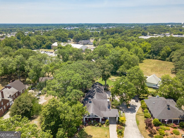 birds eye view of property with a residential view and a view of trees